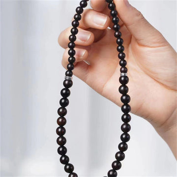 Pulsera Tibetana de Madera Ébano con Cuenta Dzi – Doble Vuelta