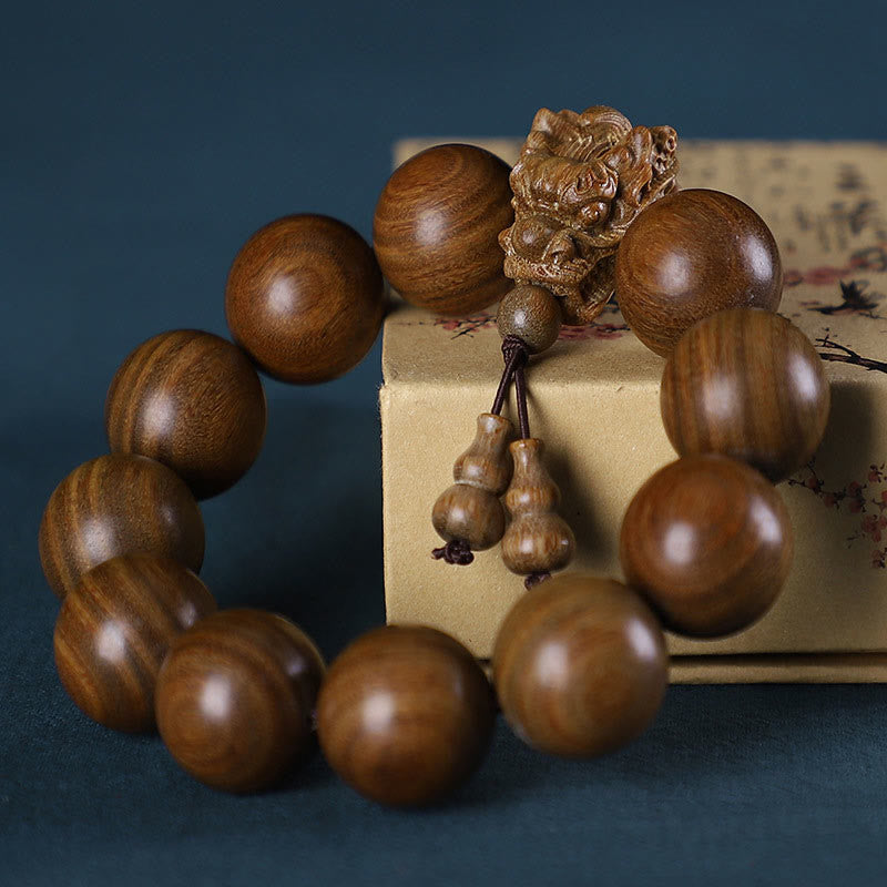 Pulsera Dragón de Madera Roja – Amuleto de Protección Natural