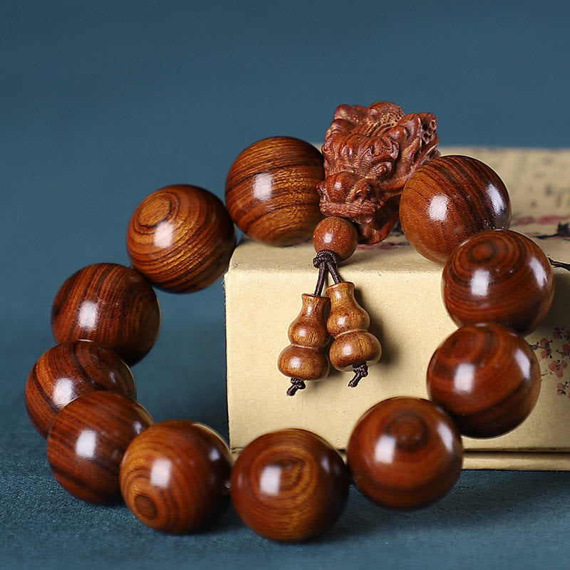 Pulsera Dragón de Madera Roja – Amuleto de Protección Natural