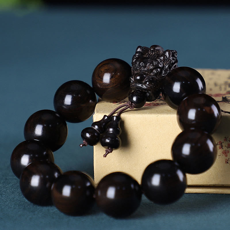 Pulsera Dragón de Madera Roja – Amuleto de Protección Natural